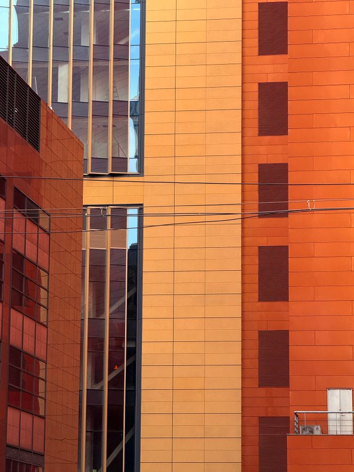 Colorful building facade with windows highlighting urban architecture.